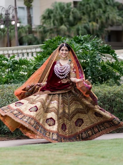 A joyful twirl in her stunning heritage lehenga by Marwar Couture. The rich jewel tones and double dupatta create a look of timeless, regal elegance.