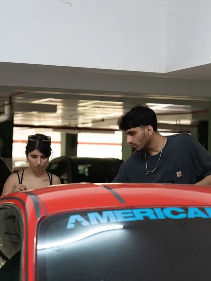 A candid shot of the collaboration behind the custom Mustang.