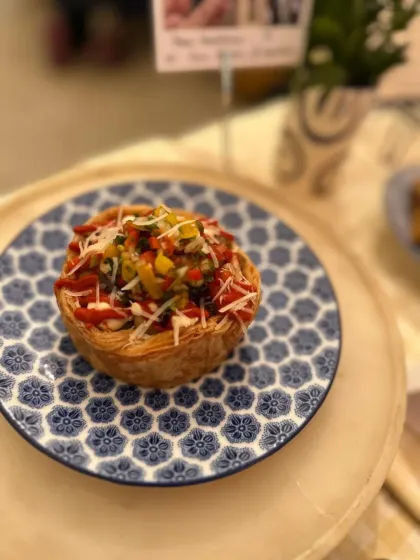 A close-up of our Dirty Fries Puff, a weekend special that combines two of our favourite things. The flaky puff pastry cup is the perfect vessel for all that cheesy, saucy goodness.