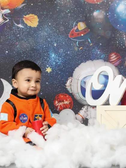One small step for baby, one giant leap for cuteness. This astronaut-themed first birthday shoot is perfect for your little explorer, complete with a galaxy backdrop, planets, and their very own spaceship.