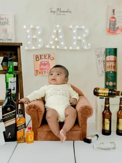Taking it all in from his armchair. The full view of the miniature bar setup shows the level of detail that goes into my creative themes.