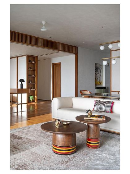 These nesting coffee tables, with their lacquered, colorful bases, are another nod to Channapatna toy craft. They are custom-designed, functional sculptures that add a playful touch to the living room.