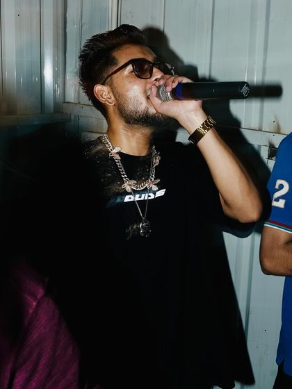 A candid moment on the mic during a desi hip hop event. I always bring authentic DHH energy, whether it's a big festival or an exclusive club night.