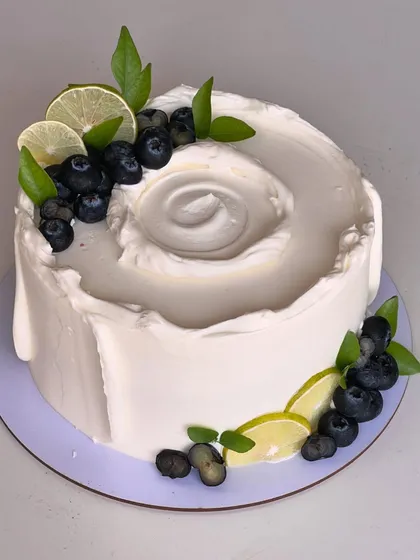 My most popular creation, the signature Italian Lemon & Blueberry cake. I offer many design variations, all featuring fresh blueberries, zesty lime, and smooth buttercream.