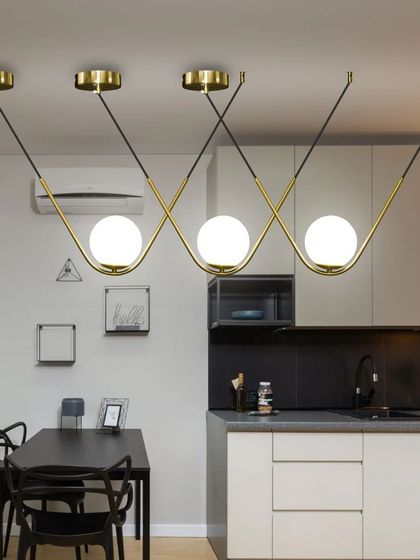 This is another view of our wavy bar pendant light, showing how it looks in a smaller kitchen space. It's a versatile piece that works well in many different settings.