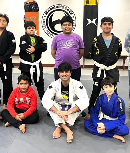 Another shot of our BJJ kids team. You can see students of different ages and belt levels training together, creating a family atmosphere where older kids help mentor the younger ones.