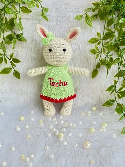 Another one of my popular bunny designs, this time in a lovely green dress with red trim, personalized with the name "Techu". I never get tired of making these sweet friends.