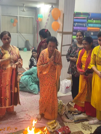 Members of our community participating in the Hawan ceremony, sharing a moment of spiritual peace and positivity.