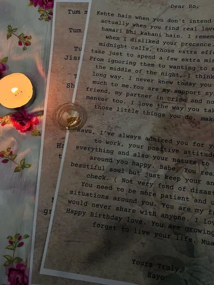 Another perspective of the candlelit letters, showing the custom text and typewriter-style font that adds to the vintage charm.