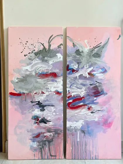 This diptych, or two-panel piece, features an explosion of pink, red, and grey. When hung together, they create a single, continuous artwork that is full of emotion and energy.
