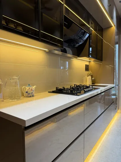 Another perspective of the Roasted Chestnut parallel kitchen, showcasing the ample counter space and under-cabinet lighting that makes the workspace bright and efficient.