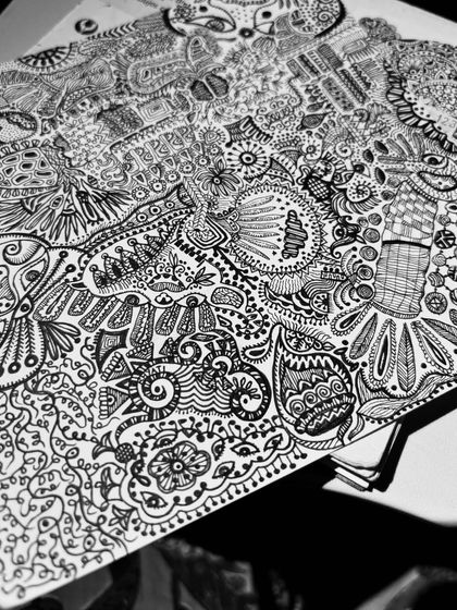 An angled view of the 'SOUL-CONNECTIONS' artwork. The piece is filled with so many elements that every time you look, you discover something new, like a face or a hidden pattern.