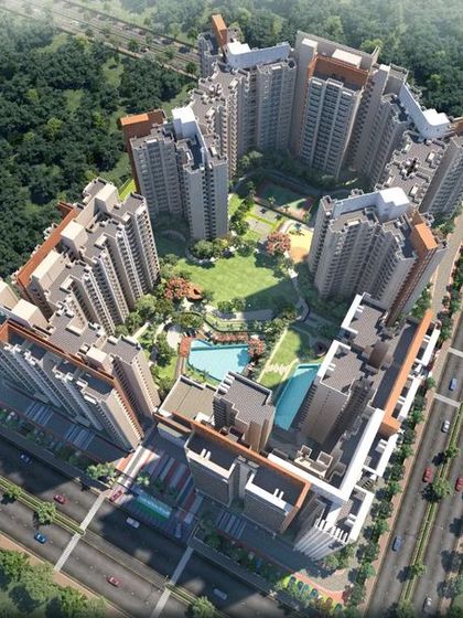 An aerial masterplan of the 'Oasis Grand Stand' township. This view shows how the central landscaped area acts as the green heart of the community, connecting the residential towers.