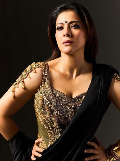 The intensity of Kajol's expression is amplified by the costume. The dark bindi and the powerful silhouette of the blouse create a look that is both captivating and formidable, perfectly suited for the film's horror genre.