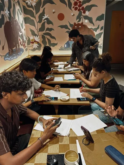 A shot of a busy workshop at a Starbucks Reserve. The beautiful murals in the cafe add to the creative atmosphere.