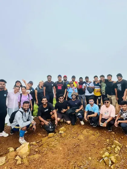 A cool pose from our trekkers at a mountain viewpoint. The feeling of being on top of the world is unmatched.
