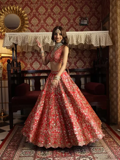 A playful and happy moment captured in a vintage setting. The bride's smile and the flowing lehenga create a feeling of effortless grace and joy.
