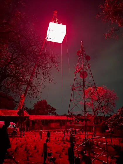 This behind-the-scenes shot from 'Kishkindhapuri' showcases our custom rigging solutions. We designed and suspended a large moonbox using Creamsource Vortex 8 lights to cast an intense, atmospheric red glow over the entire outdoor set.