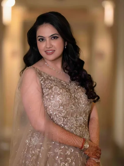 This portrait captures the bride-to-be's serene beauty. Her subtle makeup look is perfect for a sophisticated and elegant engagement party.