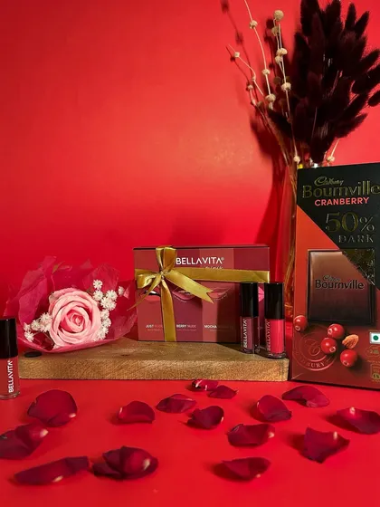 A classic expression of love. This Elegant Bloom Hamper is curated for romance, combining a forever rose, a premium lipstick set, and dark chocolate against a rich red backdrop. It’s a perfect gift for Valentine's Day, an anniversary, or just because.