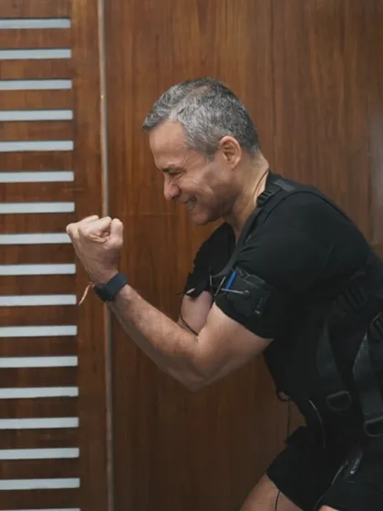 The smile of accomplishment after an intense EMS session. In just 20 minutes, you can get stronger, leaner, and fitter. It's the future of fitness, and it's here.