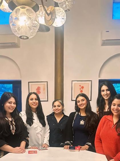 A smaller group photo from our special Women's Day event. I enjoy creating an intimate setting where guests can connect and celebrate together.