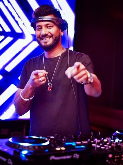 A happy moment behind the decks. When the music hits, you feel no pain.