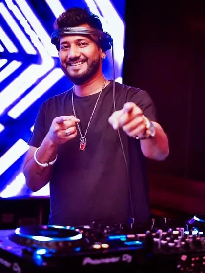 A happy moment behind the decks. When the music hits, you feel no pain.