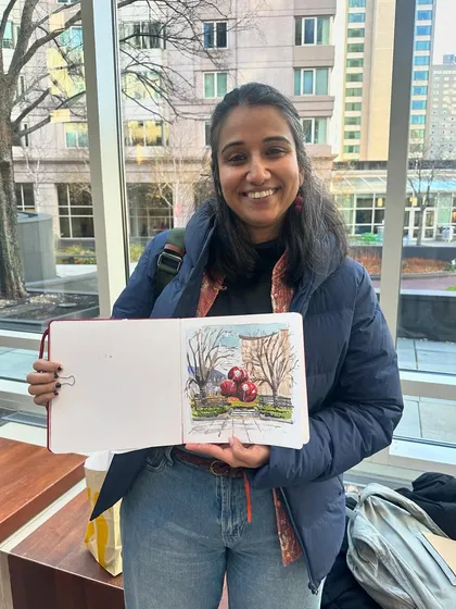 Here I am with my finished watercolour sketch of the Christmas decorations at the Prudential Center in Boston.