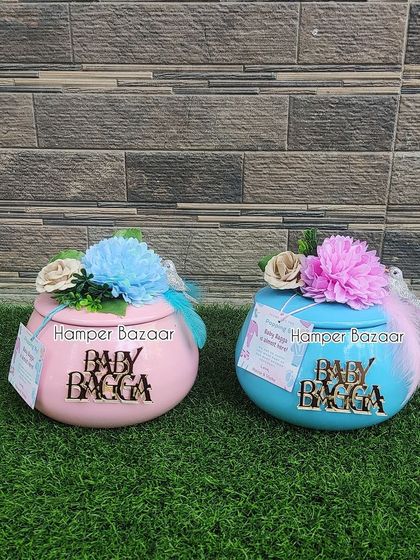 Our 'handi' hampers are available in both pink and blue, personalized with the baby's family name.