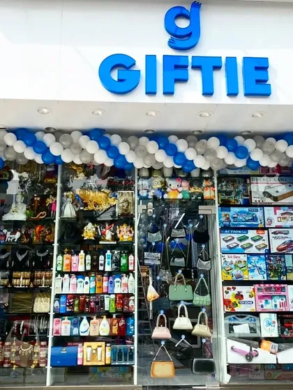 A blue and white balloon arch for the second shop opening of "Giftie," matching the brand's logo color.