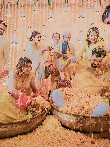 The ultimate 'phoolon ki holi'! We love creating these moments of joyful chaos where the couple is showered with love and flower petals by their family and friends.