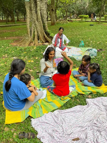 A mother and child listen together, highlighting the family-centric nature of our community. These shared experiences are what build lasting memories.
