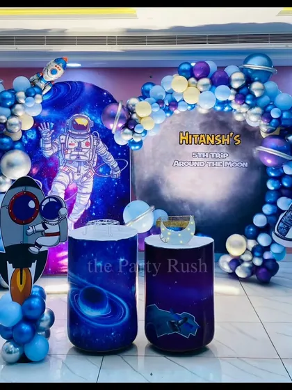I can take your party out of this world with a custom space theme. This astronaut party for Hitansh's 5th birthday features a cosmic backdrop, galaxy-themed pedestals, astronaut and rocket cutouts, and a blue and silver balloon arch that mimics the vastness of space.