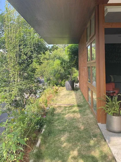 The landscape design is integral to the architecture. We carefully selected plants like weeping bamboo to create a natural privacy screen and enhance the feeling of being immersed in nature.