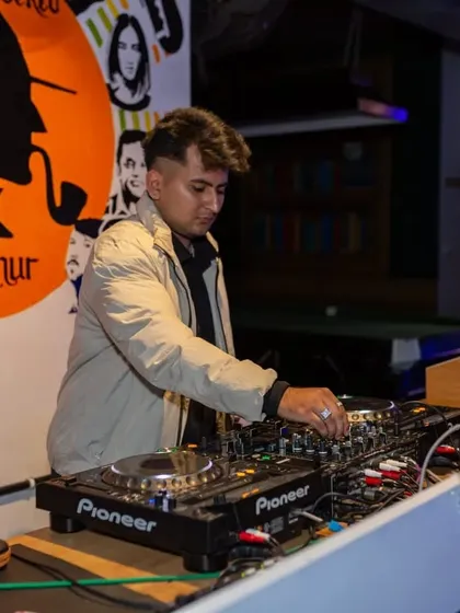 My DJ working the decks, setting the vibe for the entire night. The music is the heart of the party.