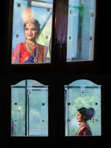 An artistic shot of the bride's reflection in decorative mirrors. I always look for creative angles to capture unique bridal portraits.