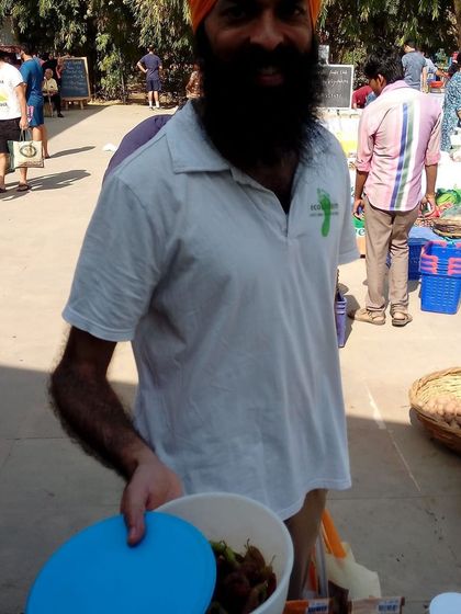 A farmer serving a customer from a tiffin box, a personal and friendly interaction.