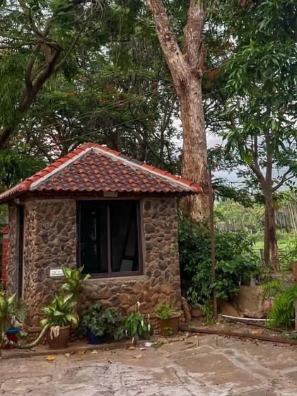 The charming stone entrance to our homestay in Chikmagalur, nestled in nature.