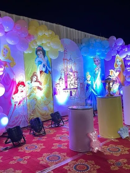 A side view of the princess stage, highlighting the balloon decorations and the individual princess panels.