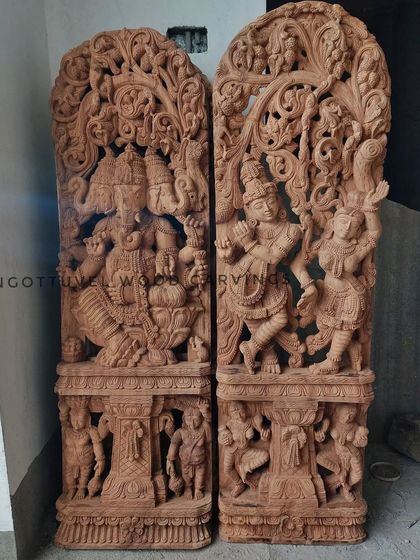 A pair of large, raw wood Jali work panels featuring Ganesha and Radha-Krishna. This shows the pieces before the finishing process, highlighting the pure sculptural form.
