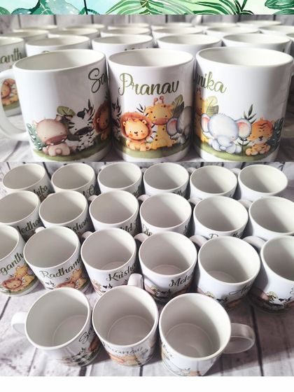 A batch of personalized jungle-themed mugs, showing the variety of names for the party guests.