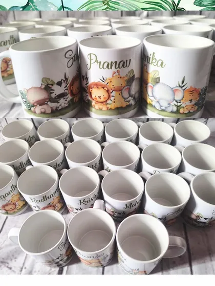 A batch of personalized jungle-themed mugs, showing the variety of names for the party guests.
