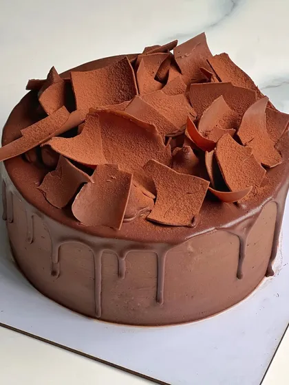 A classic Dutch Truffle style cake with a rich chocolate drip and delicate chocolate shards on top. Simple, elegant, and incredibly delicious.