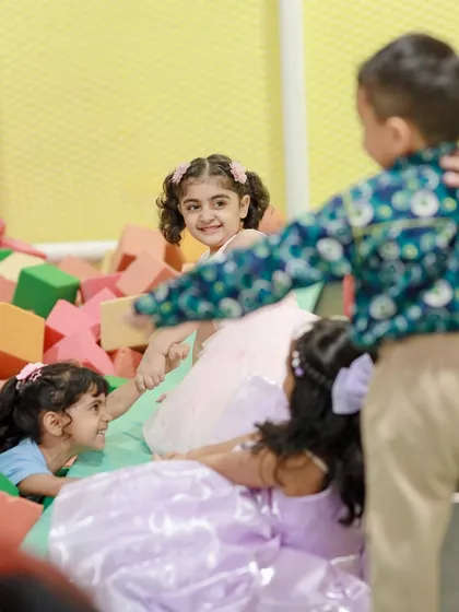 Building, jumping, and tumbling in our soft foam block pit. This area is perfect for creative construction and energetic play.