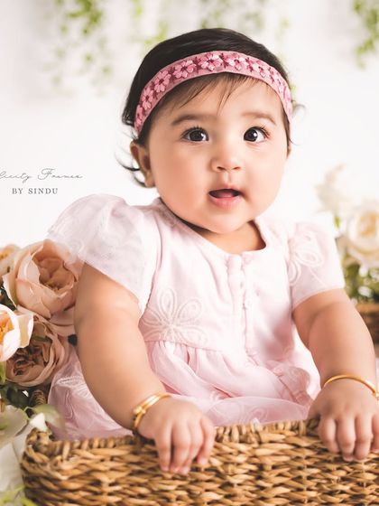 A basket of cuteness! Using props like this wicker basket adds a lovely texture and dimension to sitter portraits, while keeping the baby safe and supported.