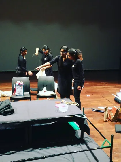 The team setting up the stage for a performance at the Canadian International School's art festival.