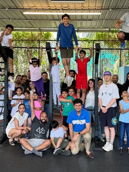 This is our family. Kids, adults, parents, and coaches, all sharing a space to move, learn, and cheer each other on. This is the energy you'll find at our academy.