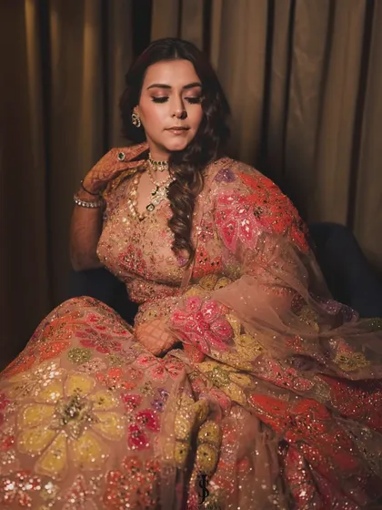For her Sangeet, my sister wore this breathtaking floral lehenga by Seema Gujral. The design, with floral motifs that grow larger down the skirt, creates a beautiful elongating effect.
