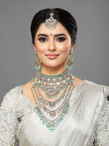 A classic portrait of the client, her makeup looking clean, fresh, and perfectly symmetrical.